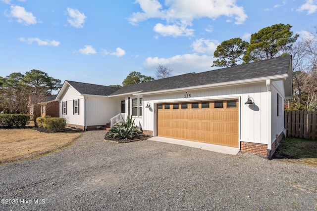 single story home featuring a garage