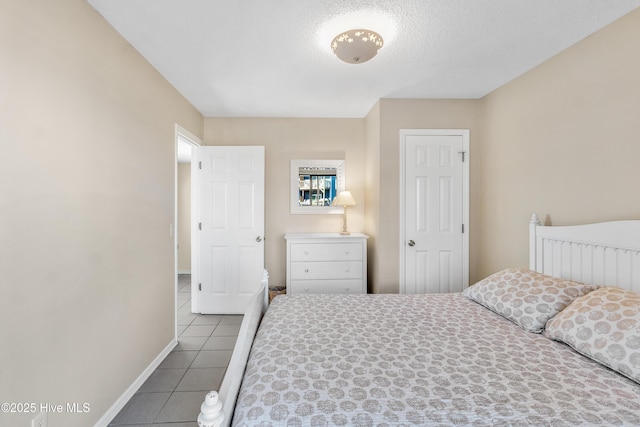 1928 New River Inlet Rd Unit 215, North Topsail Beach, NC 28460 - bedroom with visible vents, baseboards, tile patterned flooring, and access to outside