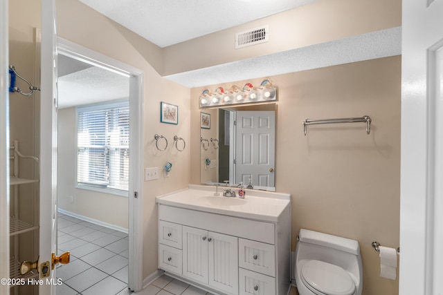 1928 New River Inlet Rd Unit 215, North Topsail Beach, NC 28460 - hall featuring tile patterned flooring, a textured ceiling, baseboards, and a healthy amount of sunlight