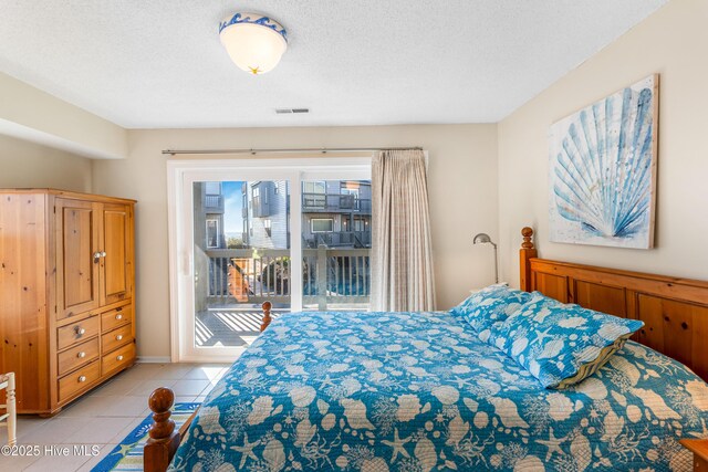 1928 New River Inlet Rd Unit 215, North Topsail Beach, NC 28460 - bathroom featuring visible vents, vanity, toilet, baseboards, and tile patterned floors