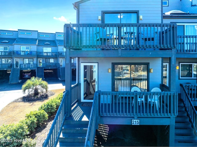 rear view of property with a balcony