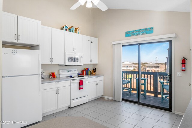 kitchen with high vaulted ceiling, white cabinets, light tile patterned floors, ceiling fan, and white appliances