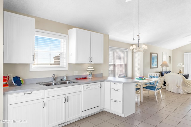 kitchen featuring pendant lighting, white dishwasher, sink, and white cabinets