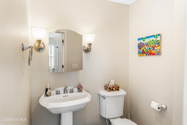 bathroom with sink and toilet