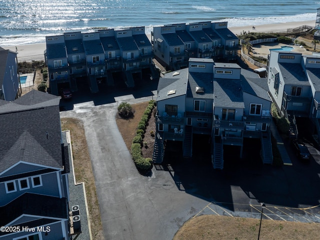 aerial view with a water view and a view of the beach