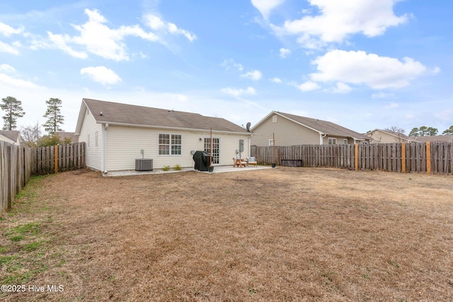 back of property featuring a yard, a patio area, and central AC unit