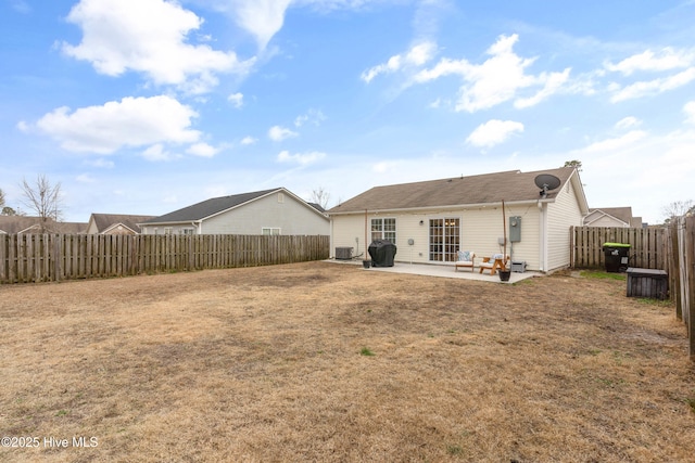 back of property featuring central air condition unit, a patio area, and a lawn