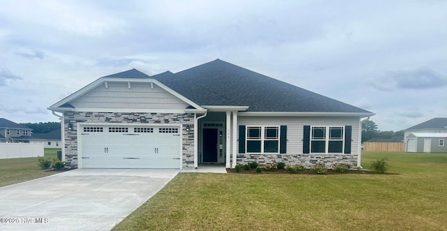 craftsman house featuring a garage and a front lawn