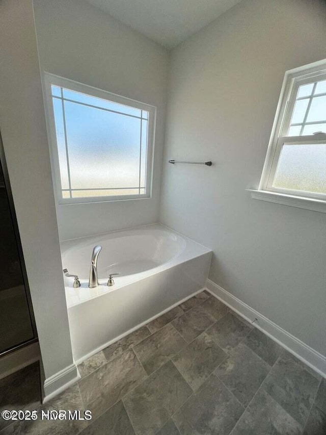 bathroom with a tub