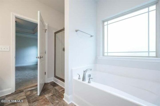 1132 Coral Reef Dr, New Bern, NC 28560 - bathroom with a garden tub, a stall shower, and baseboards