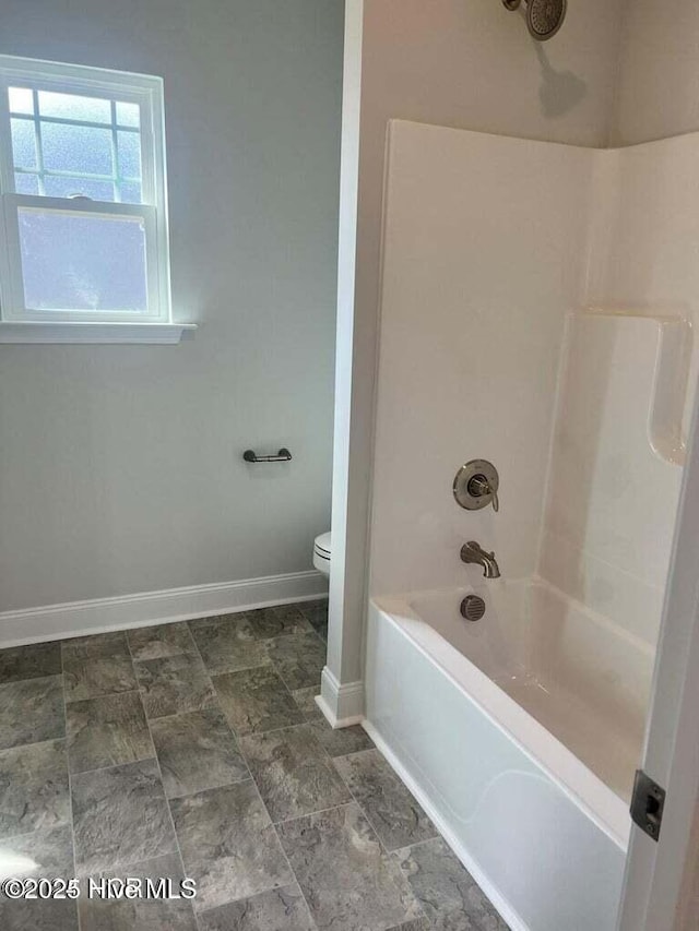 1132 Coral Reef Dr, New Bern, NC 28560 - bathroom with toilet, baseboards, and shower / bath combination