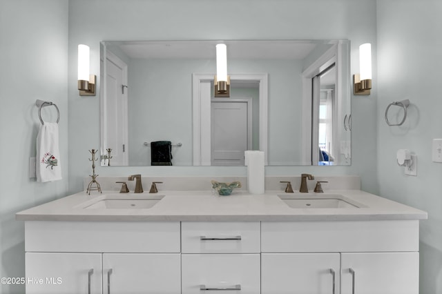 bathroom with double vanity and a sink