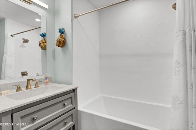 bathroom with shower / tub combo with curtain and vanity