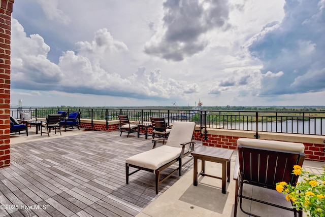 wooden terrace featuring outdoor lounge area