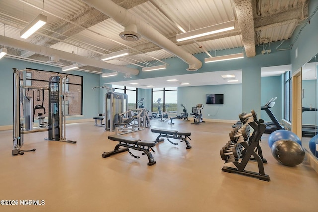 workout area featuring baseboards