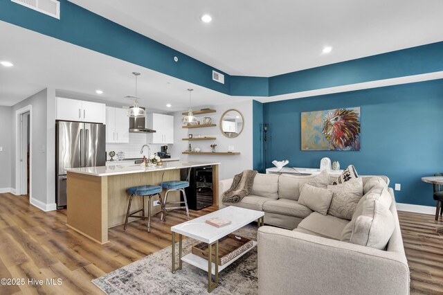 sitting room featuring baseboards and wood finished floors