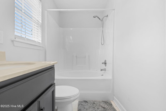 full bathroom with vanity, tub / shower combination, and toilet