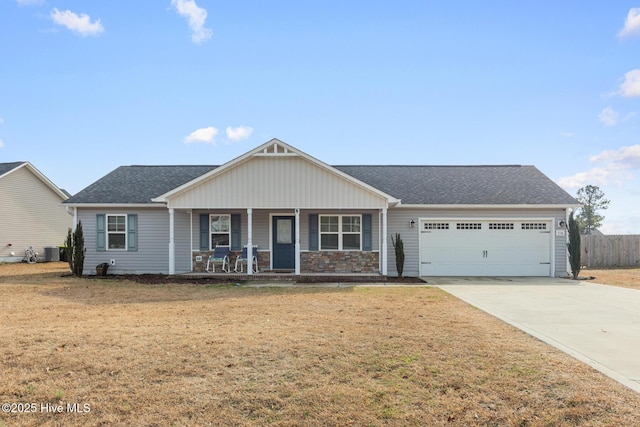 single story home featuring a garage, a front lawn, central air condition unit, and covered porch