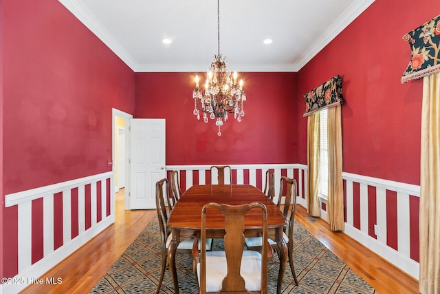 1824 Starfix Ter, Wilmington, NC 28405 - dining space featuring a chandelier, wood finished floors, crown molding, and recessed lighting