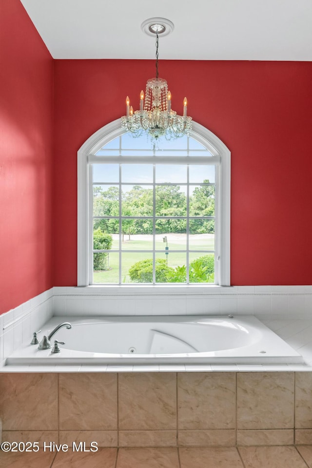 1824 Starfix Ter, Wilmington, NC 28405 - full bathroom featuring a chandelier and a jetted tub