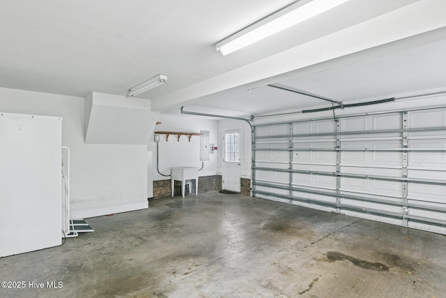 1824 Starfix Ter, Wilmington, NC 28405 - garage with electric panel and freestanding refrigerator