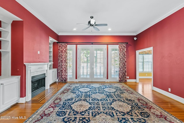 1824 Starfix Ter, Wilmington, NC 28405 - living room with healthy amount of natural light, a ceiling fan, ornamental molding, light wood finished floors, and recessed lighting