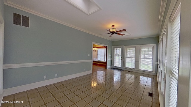 tiled empty room featuring crown molding and ceiling fan