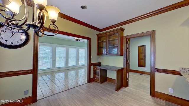 interior space with crown molding, ceiling fan with notable chandelier, and light hardwood / wood-style flooring