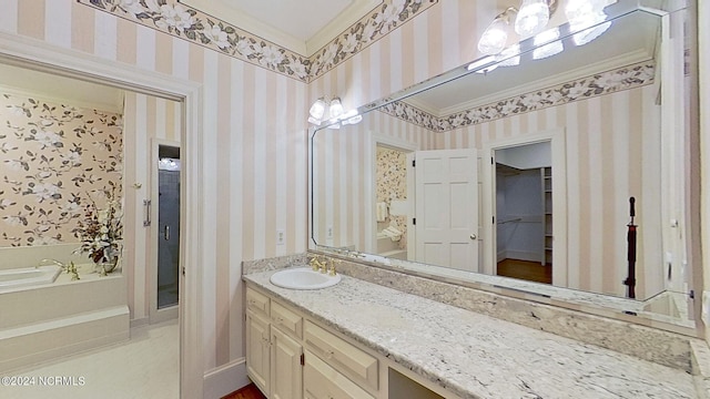 bathroom with ornamental molding and vanity