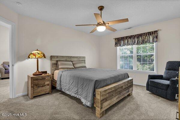 bedroom featuring carpet flooring and ceiling fan