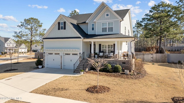 craftsman-style home with a garage and a porch