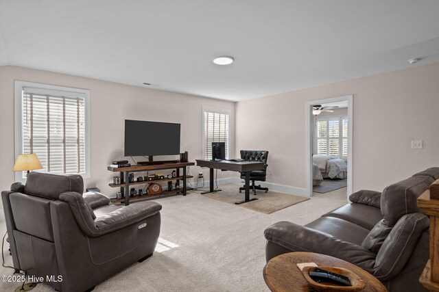 living room featuring light carpet