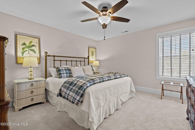 carpeted bedroom featuring ceiling fan