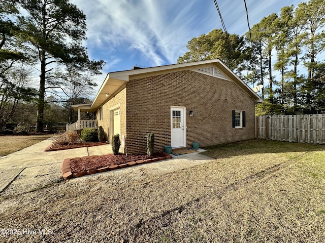 view of property exterior featuring a lawn