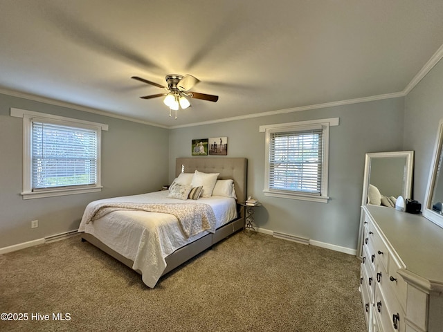 carpeted bedroom with ceiling fan and ornamental molding