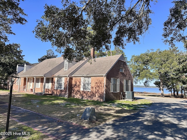 view of front of property featuring a porch and central air condition unit