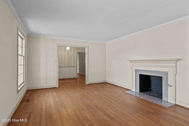 unfurnished living room featuring light wood-type flooring and crown molding