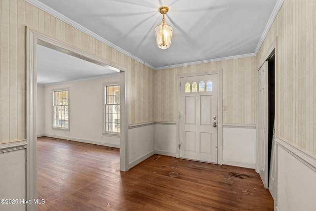 entryway with crown molding and dark hardwood / wood-style floors