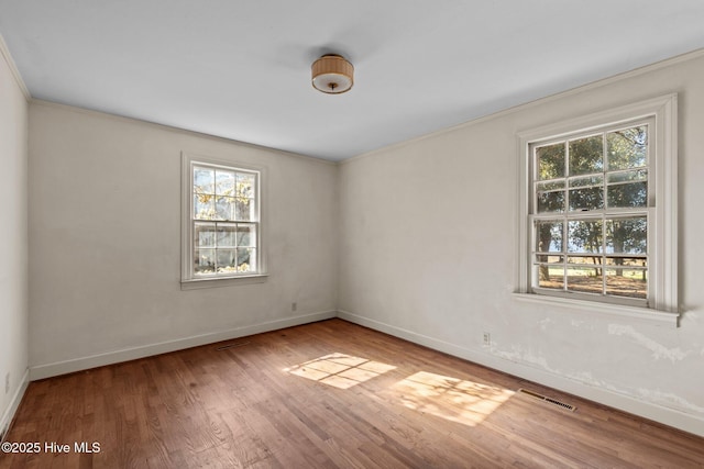 unfurnished room featuring wood-type flooring