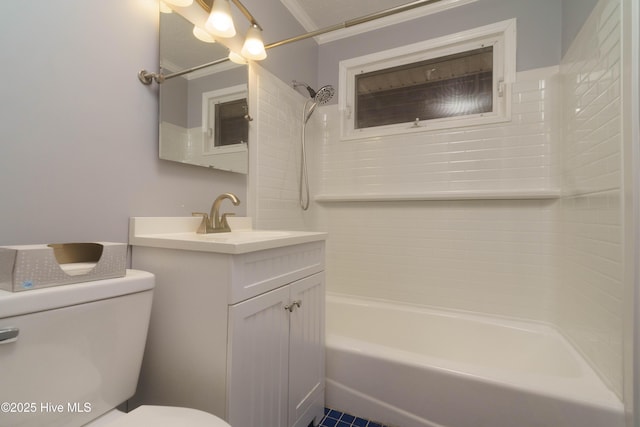 full bathroom with vanity, tiled shower / bath combo, and toilet