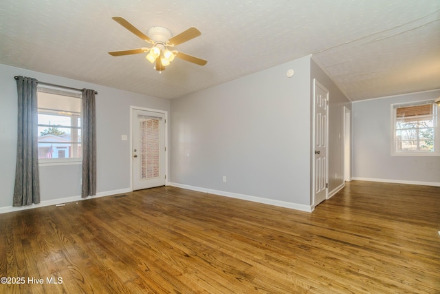 unfurnished room featuring hardwood / wood-style flooring, a textured ceiling, and ceiling fan