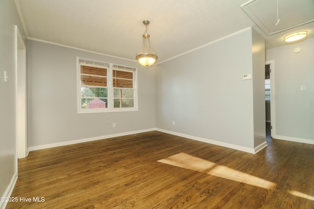 unfurnished room with ornamental molding and dark hardwood / wood-style floors