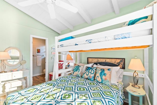 bedroom with vaulted ceiling with beams and wood finished floors