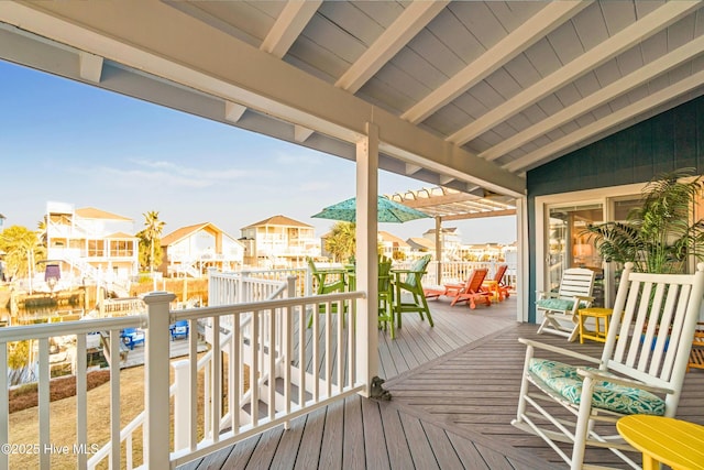 wooden terrace with a residential view