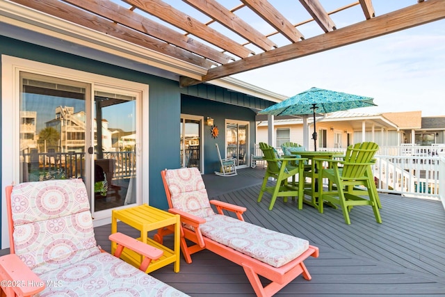 wooden terrace featuring outdoor dining space and a pergola