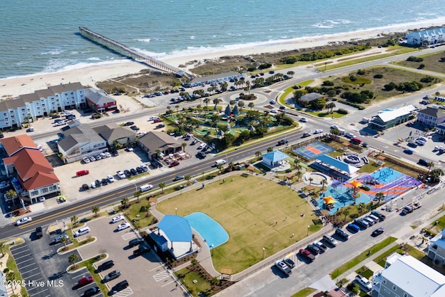 aerial view with a water view and a view of the beach