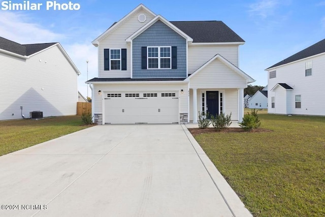 front of property with a garage, central air condition unit, and a front lawn