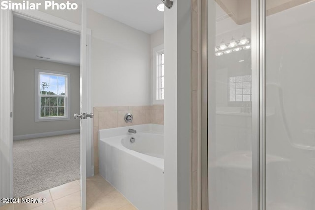 bathroom with plus walk in shower and tile patterned floors