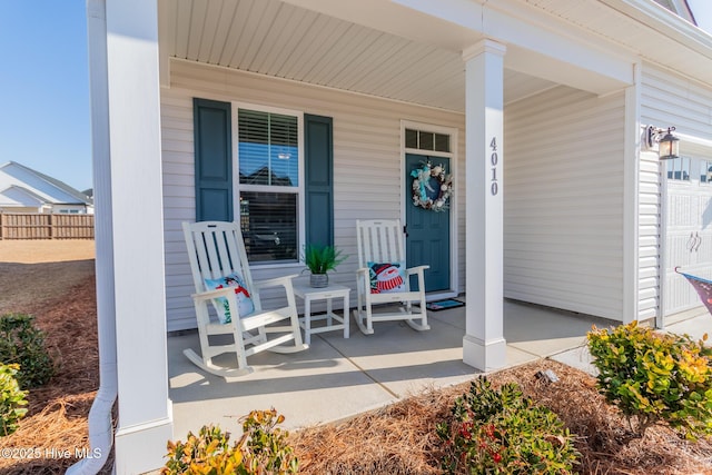 view of patio / terrace featuring a garage and covered porch