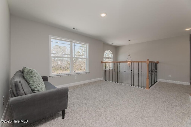 living area with light colored carpet